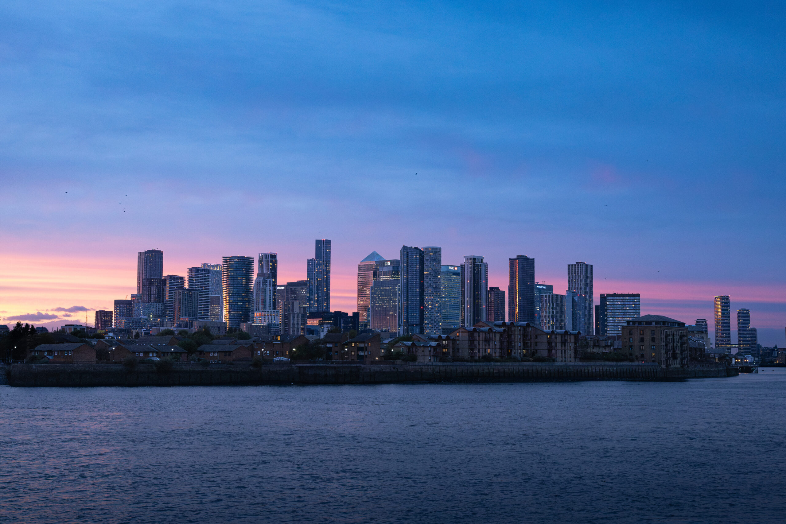 Canary Wharf skyline at sunset across the River Thames, seen from Greenwich.